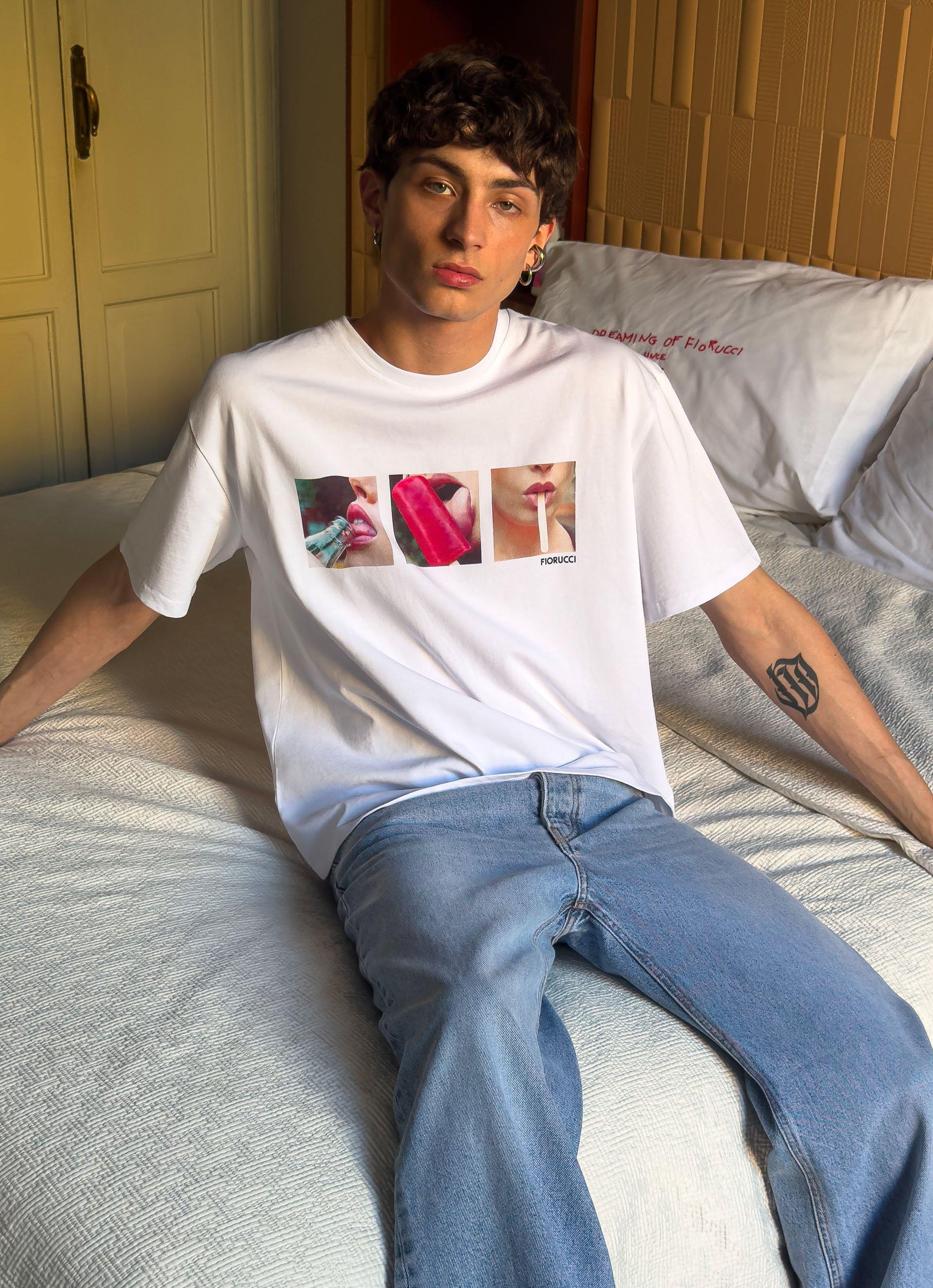 Model wears the Popsicle T-Shirt in White and the Straight Fit Jeans in Light Blue.